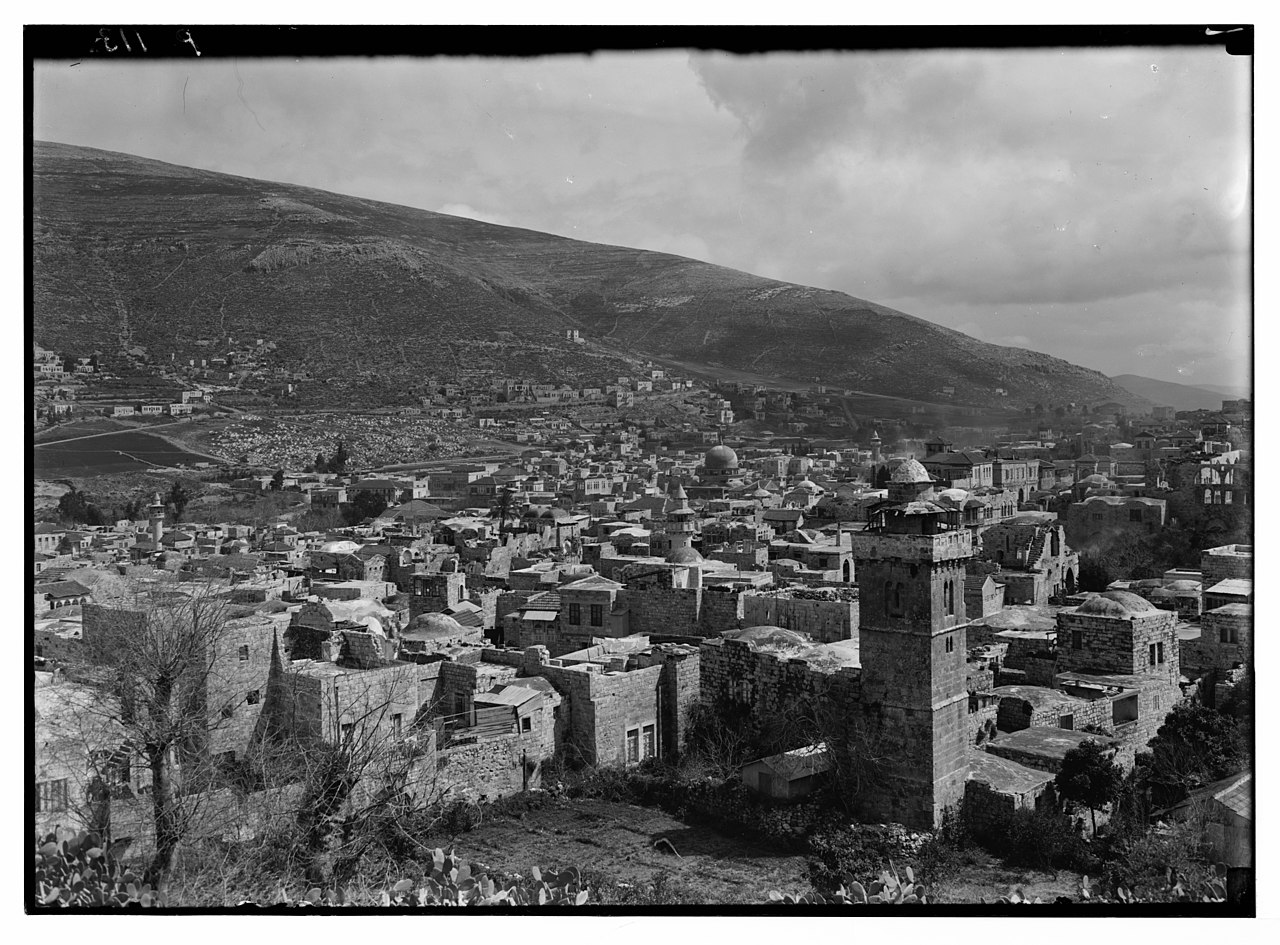 A vintage photograph of the valley at Nablus in Samaria, set between the slopes of Mount Ebal and Mount Gerizim.
