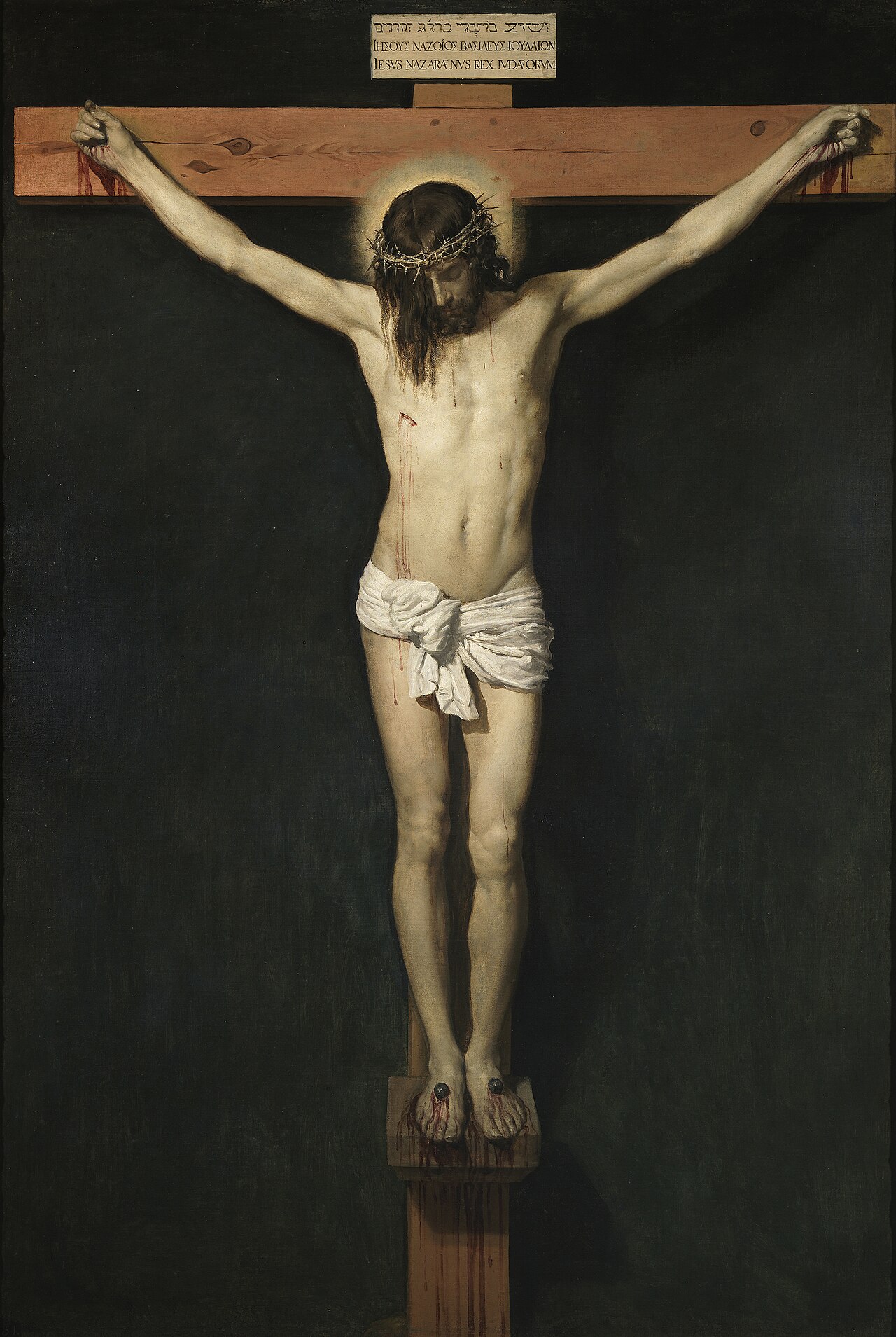 Velázquez's painting of Christ crucified against a black background, serene and solitary.